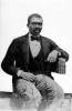 man seated in suit